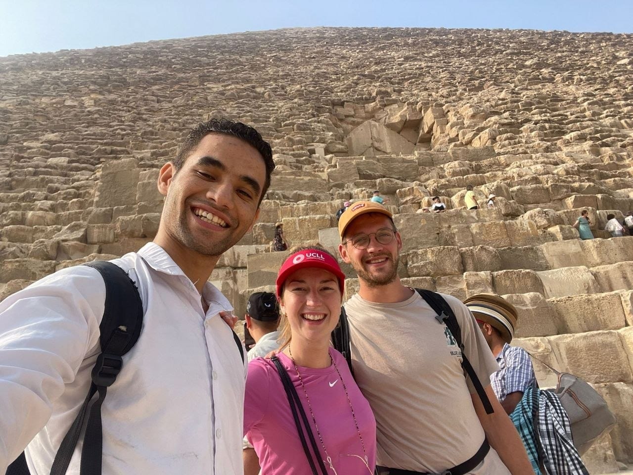 Amr with two travelers at the foot of the Great Pyramid